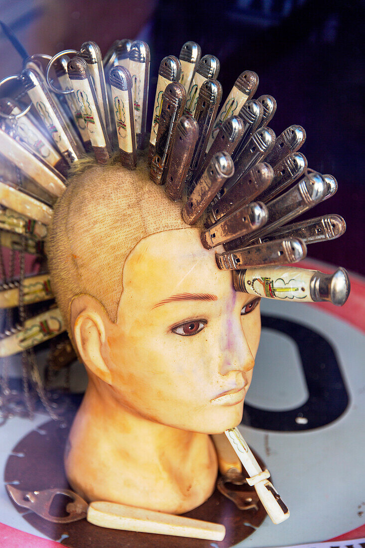 Mannequin with an Iroquois cut made with planted knives.