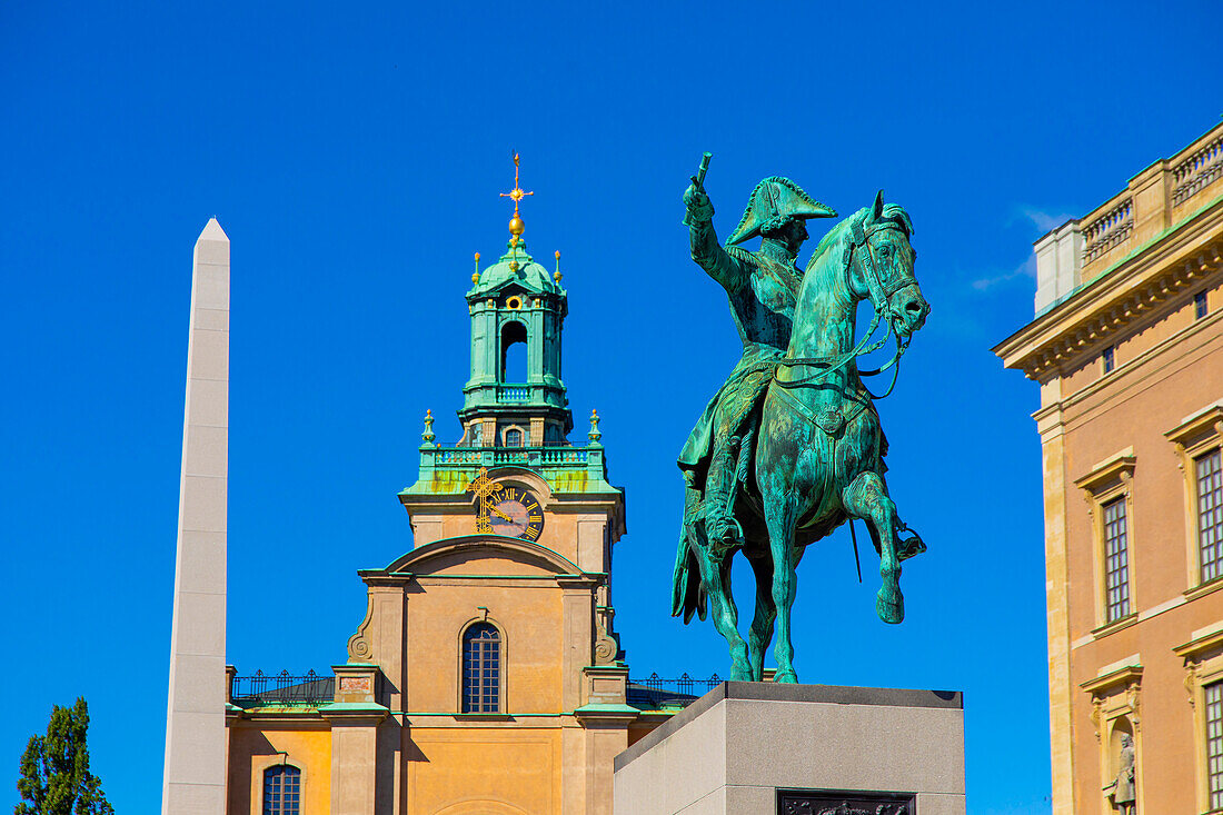 Europe,Scandinavia,Sweden. Stockholm. Statue of Charles XIV John at Slussplan. Gamla Stan district. Storkyrkan Cathedral. Royal palace