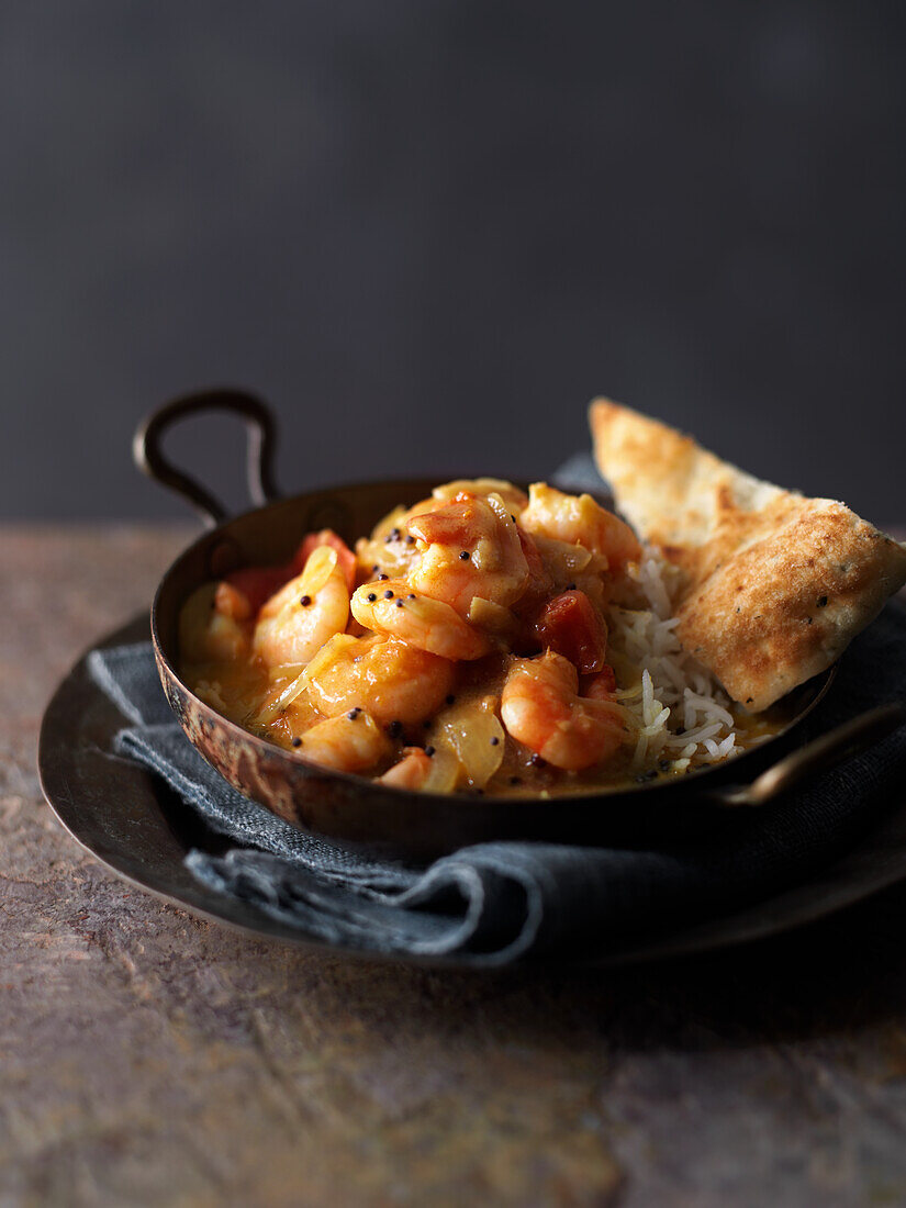 Prawn curry with rice and bread