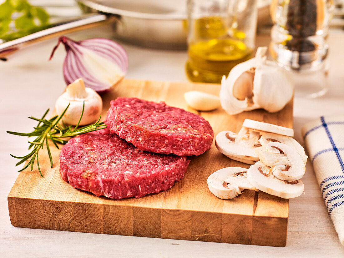 Raw beef steak with mushrooms and onions
