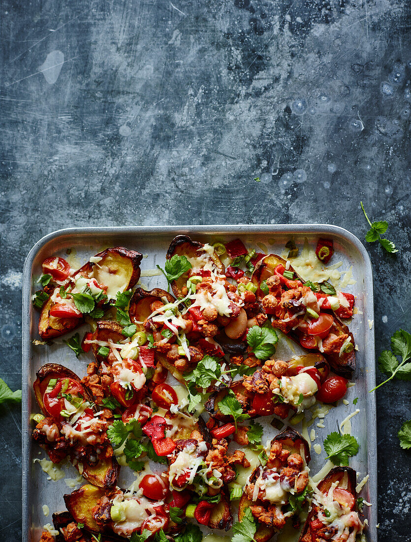 Potato skins baked with cheese and vegetables