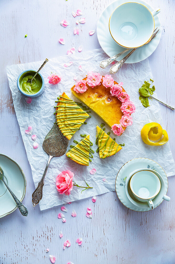 Cheesecake with pistachio cream and rose decoration