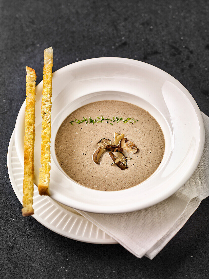 Cream of mushroom soup with garlic sticks