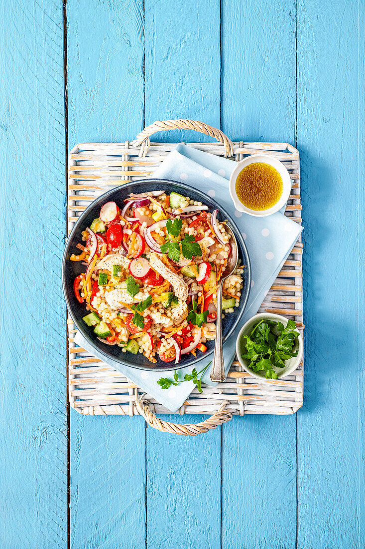 Chicken couscous salad with parsley and dressing