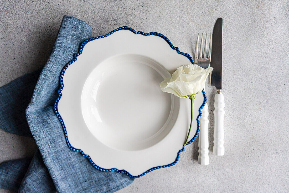 Minimalist table decoration with white azalea flower