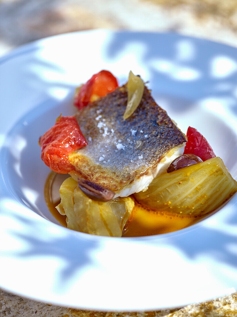 Sea bass fillet with fennel, saffron and black olives