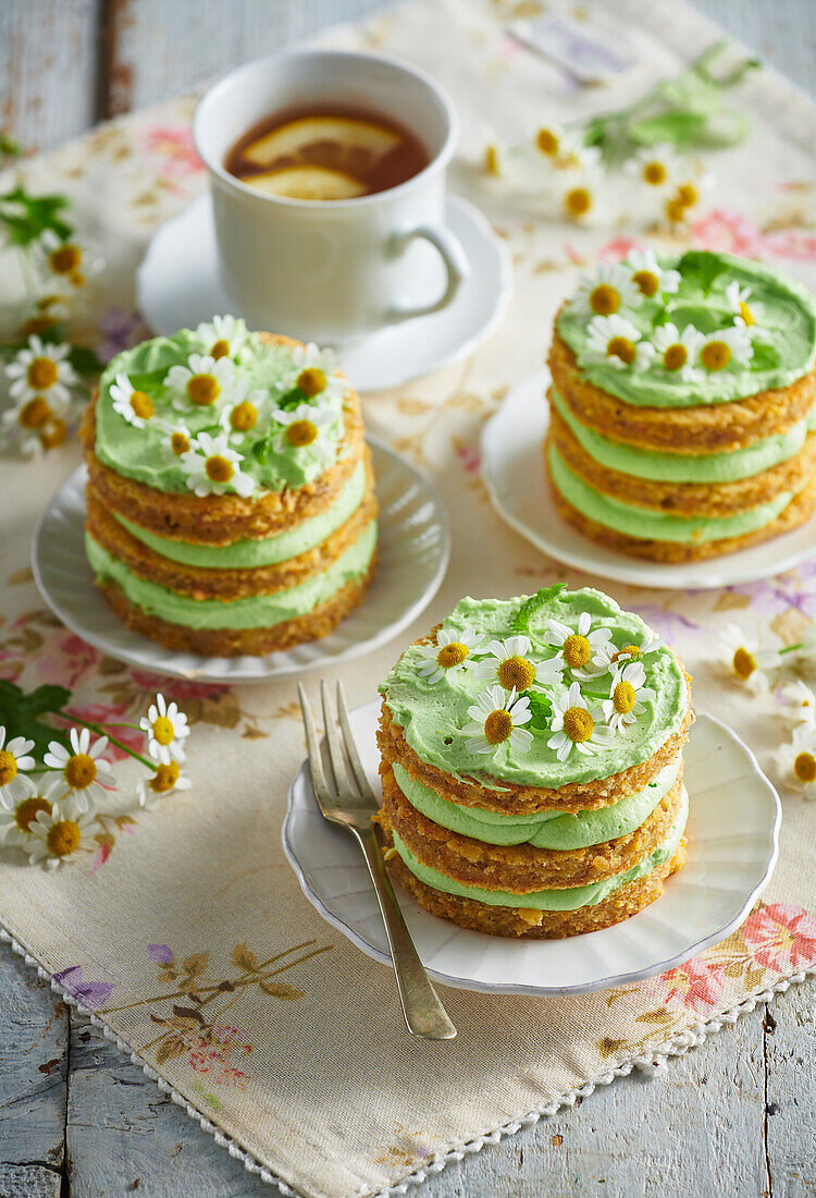 Carrot tartlets with pistachio cream and camomile flowers