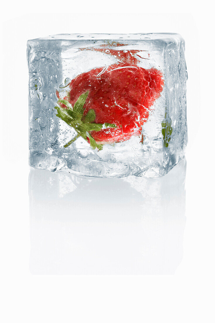 Ice cubes with enclosed strawberry