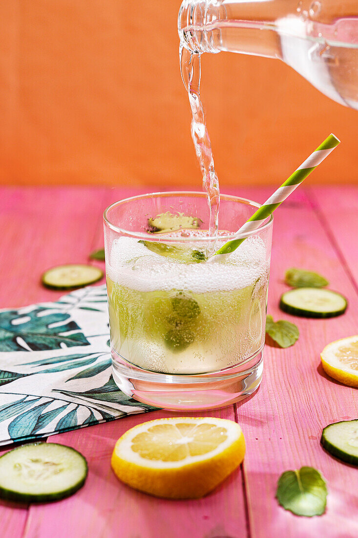 Lemon and cucumber drink with mint ice cubes