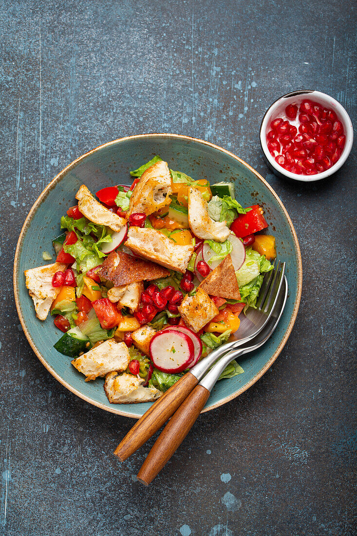 Fattoush salad with pita croutons and vegetables