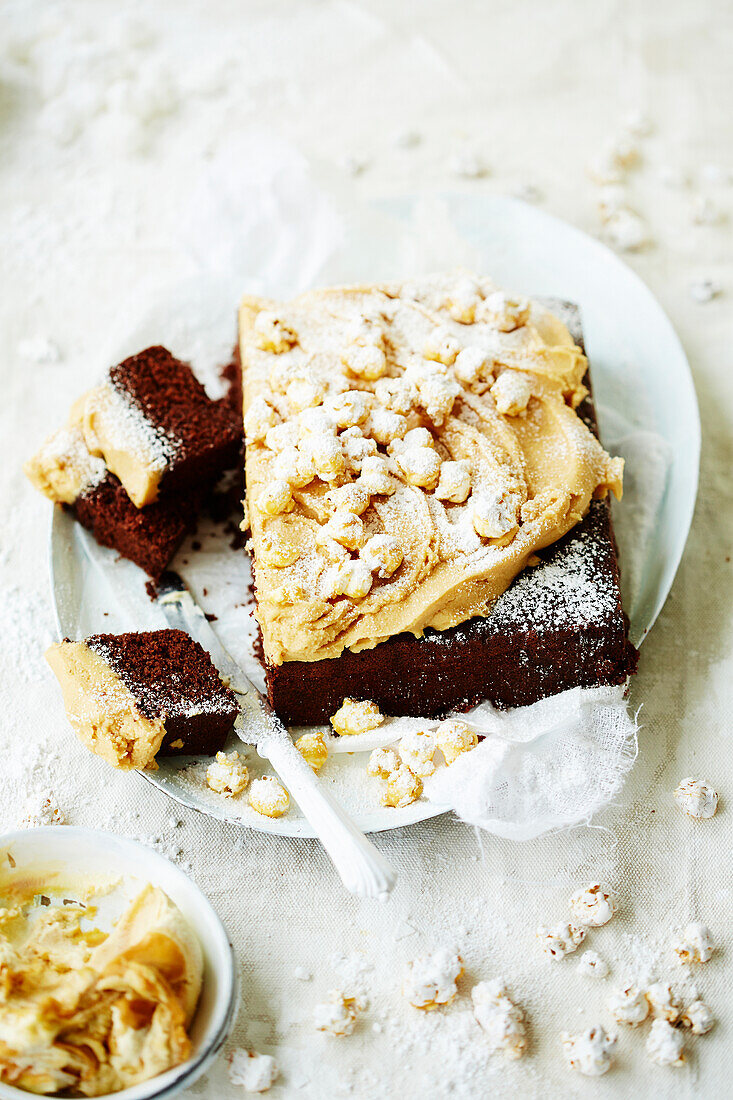 Chocolate cake with peanut butter cream and popcorn