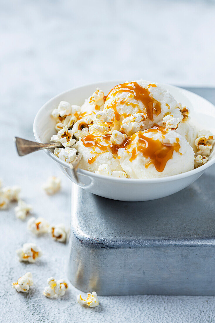 Vanilla ice cream with caramel sauce and popcorn