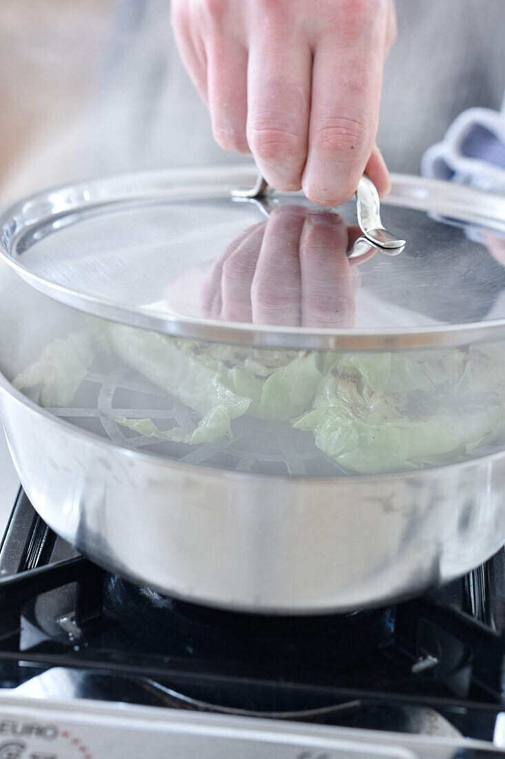 Smoked pointed cabbage in a pot