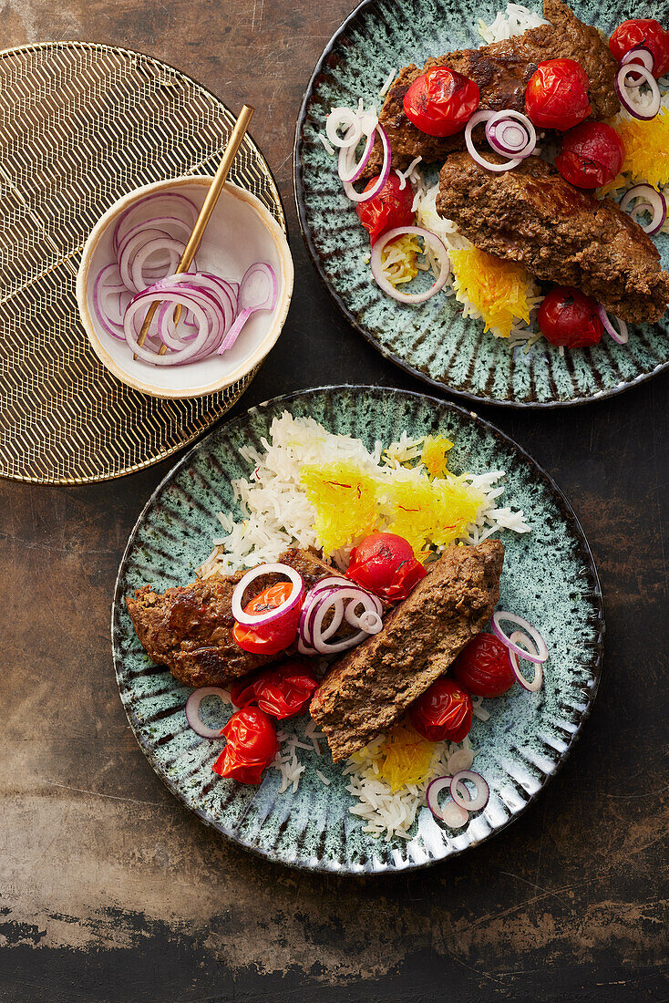 Persian pan-fried kabobs with rice and tomatoes