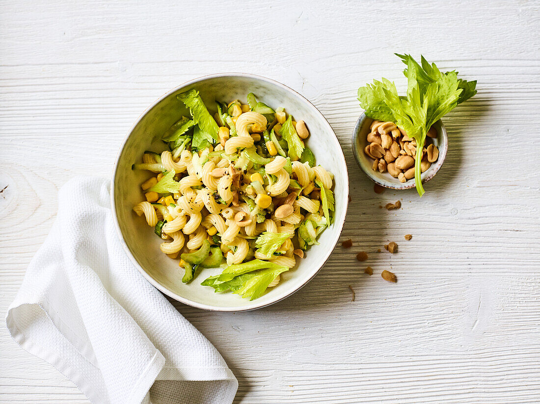 Zucchini and pasta salad with celery and peanuts