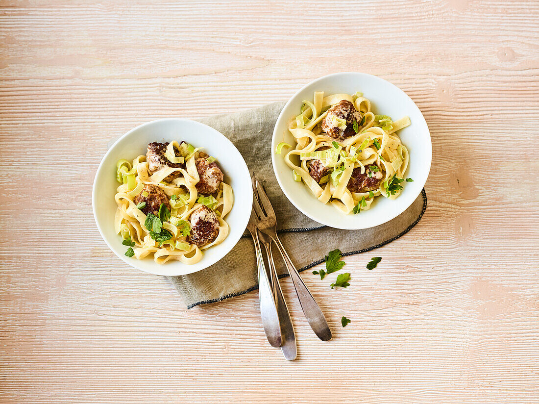 Ribbon noodle salad with meatballs