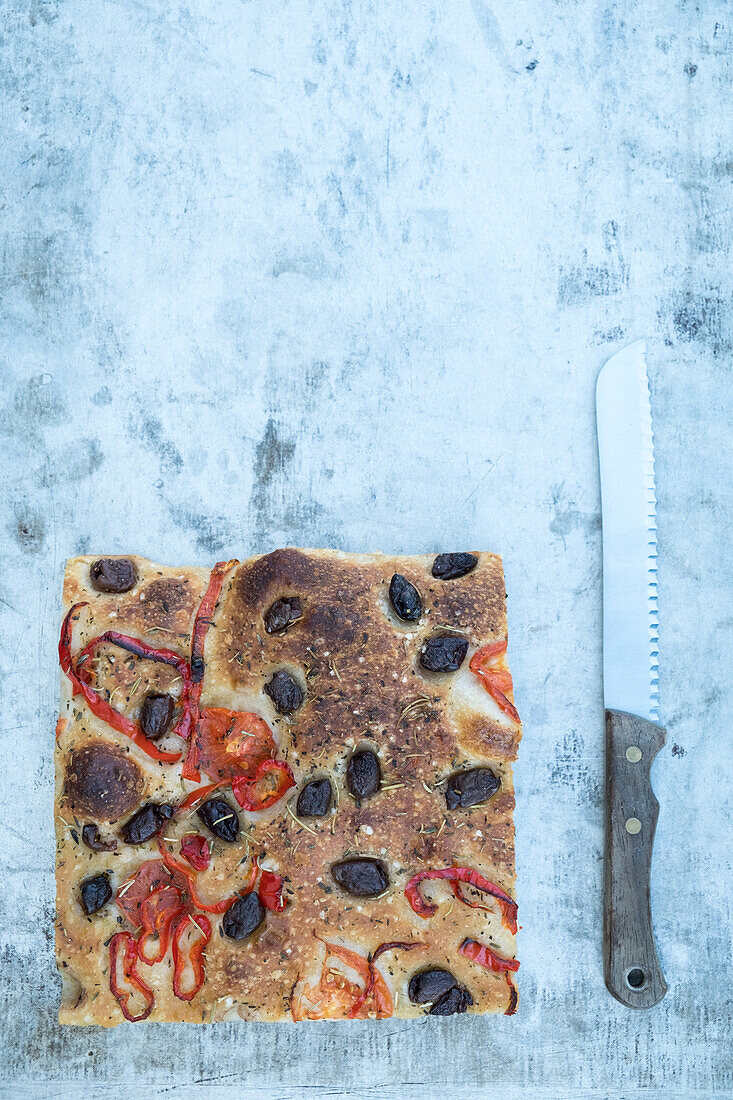 Focaccia with peppers and black olives