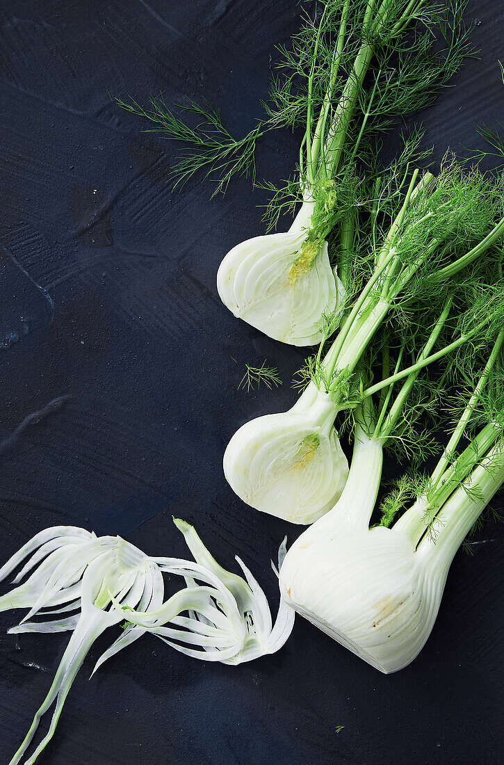 Whole and sliced fennel bulbs