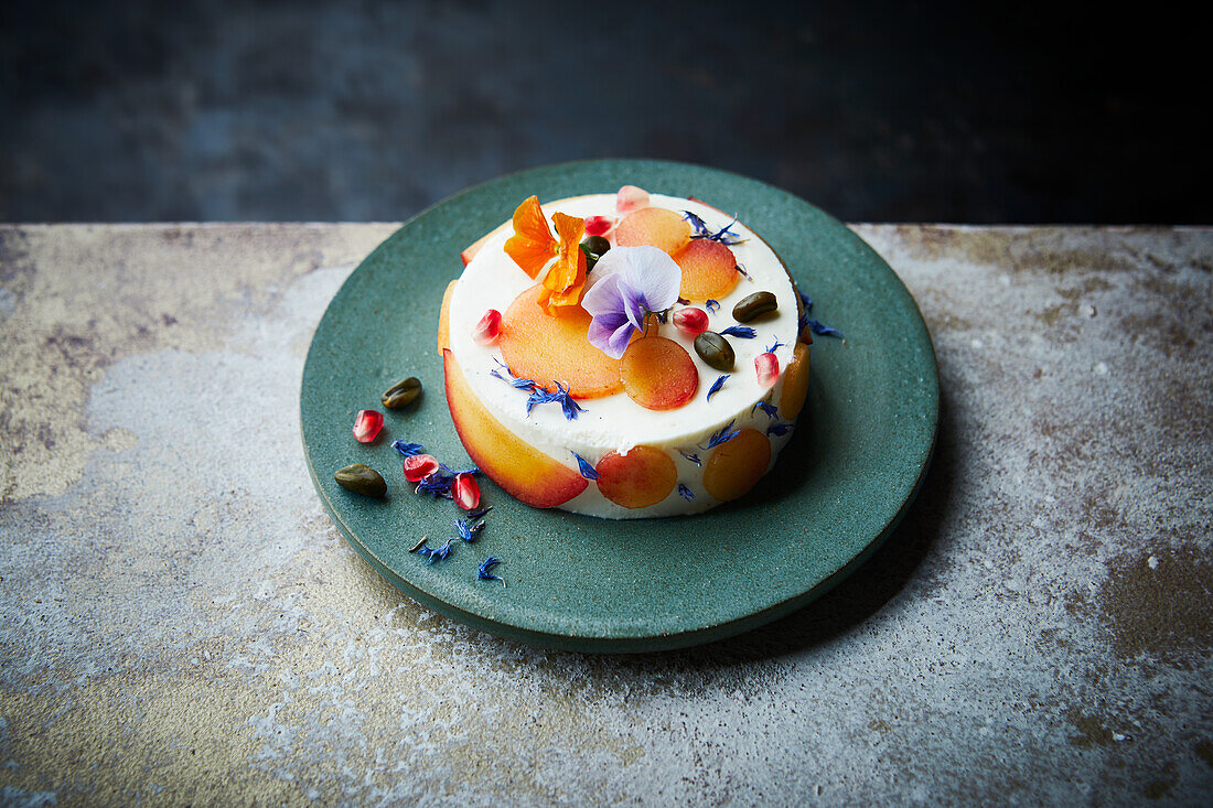 Autumn cheesecake with fruit and flowers