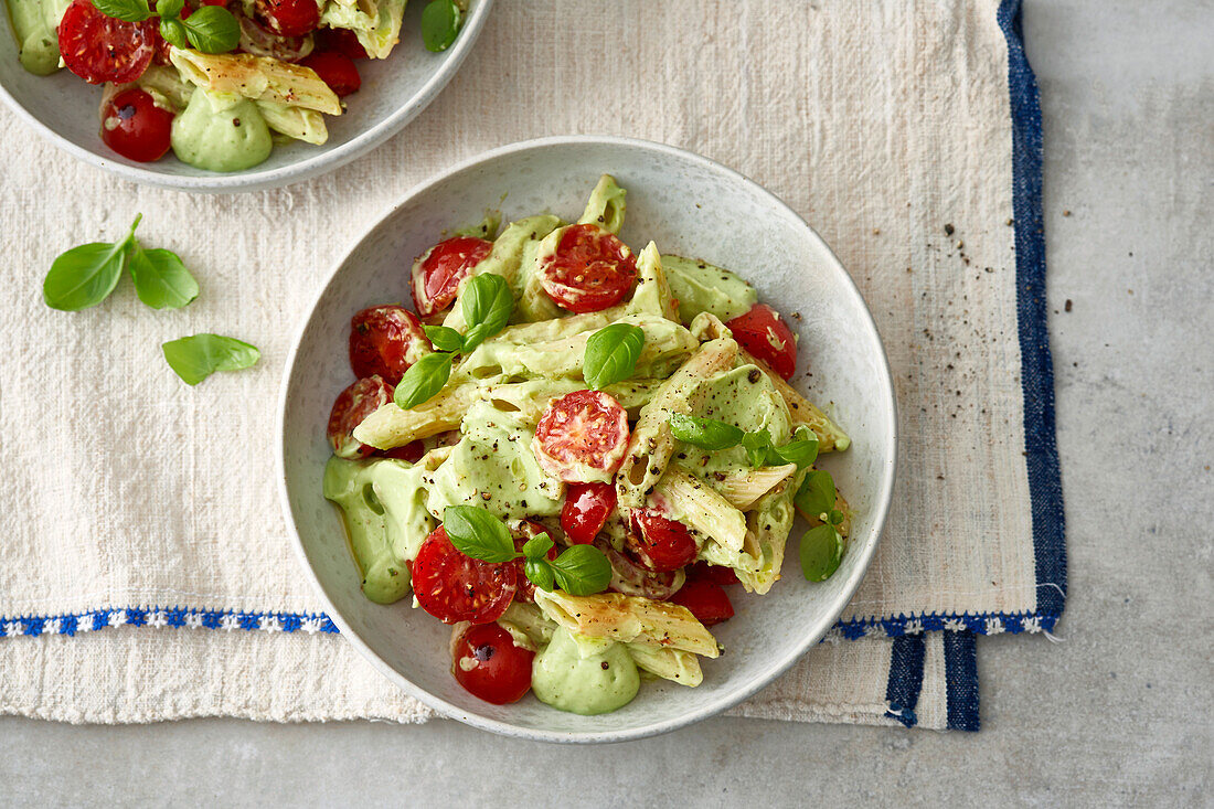 Pasta salad with cherry tomatoes and basil