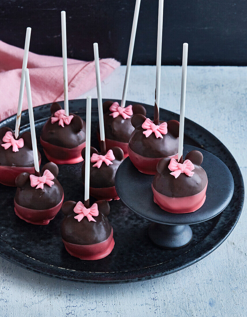 Minnie Mouse cake pops with pink ribbons