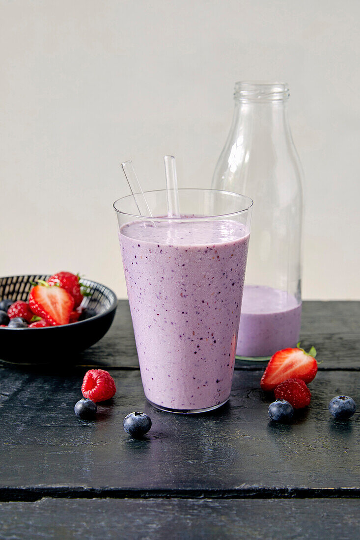 Berry and protein smoothie with fresh fruit