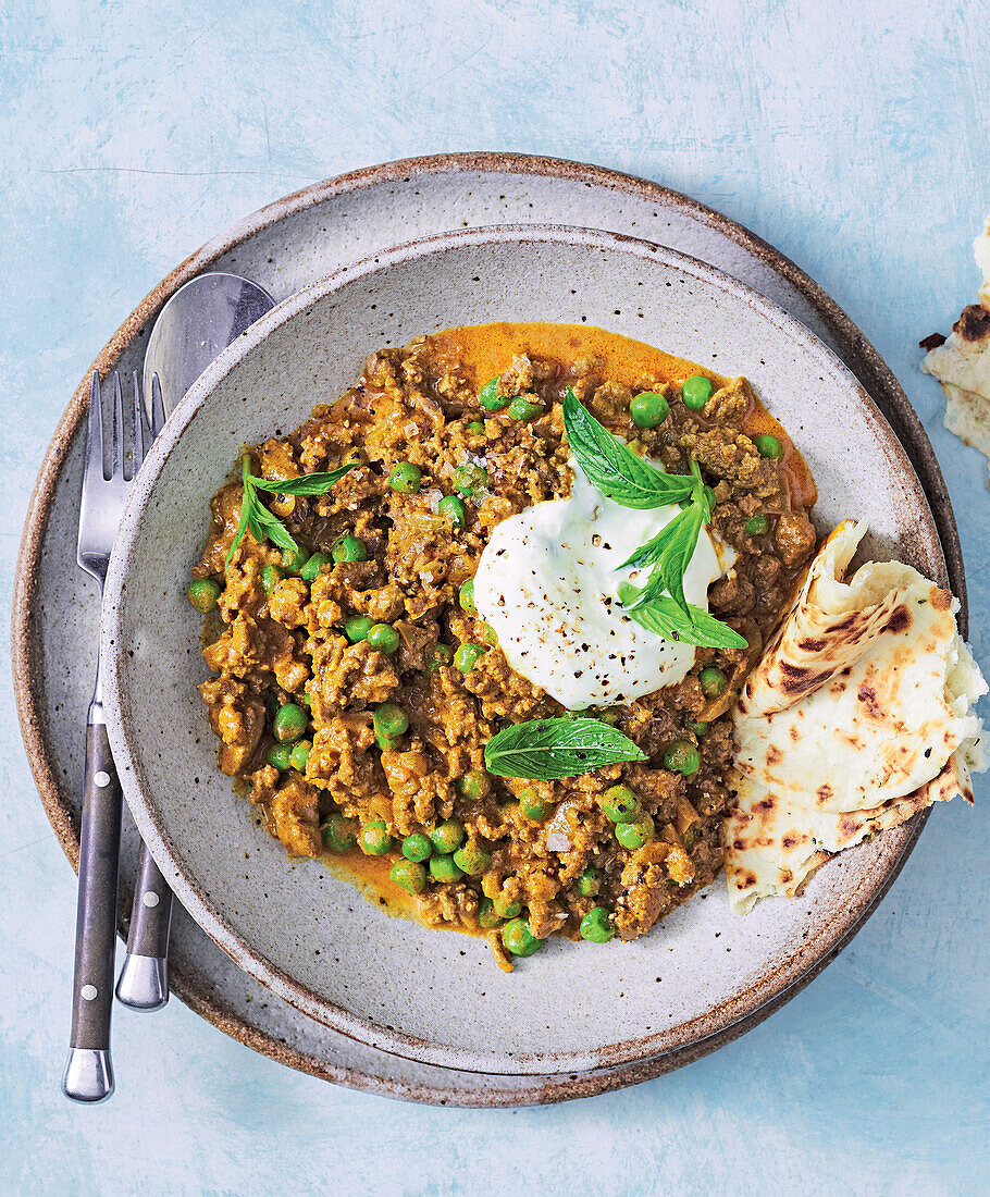 Keema beef curry with peas and naan bread