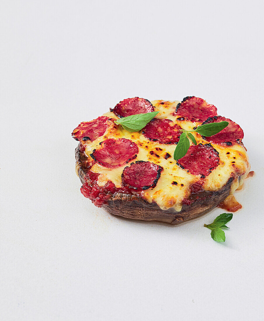 Portobello mushroom pizza with cheese and salami