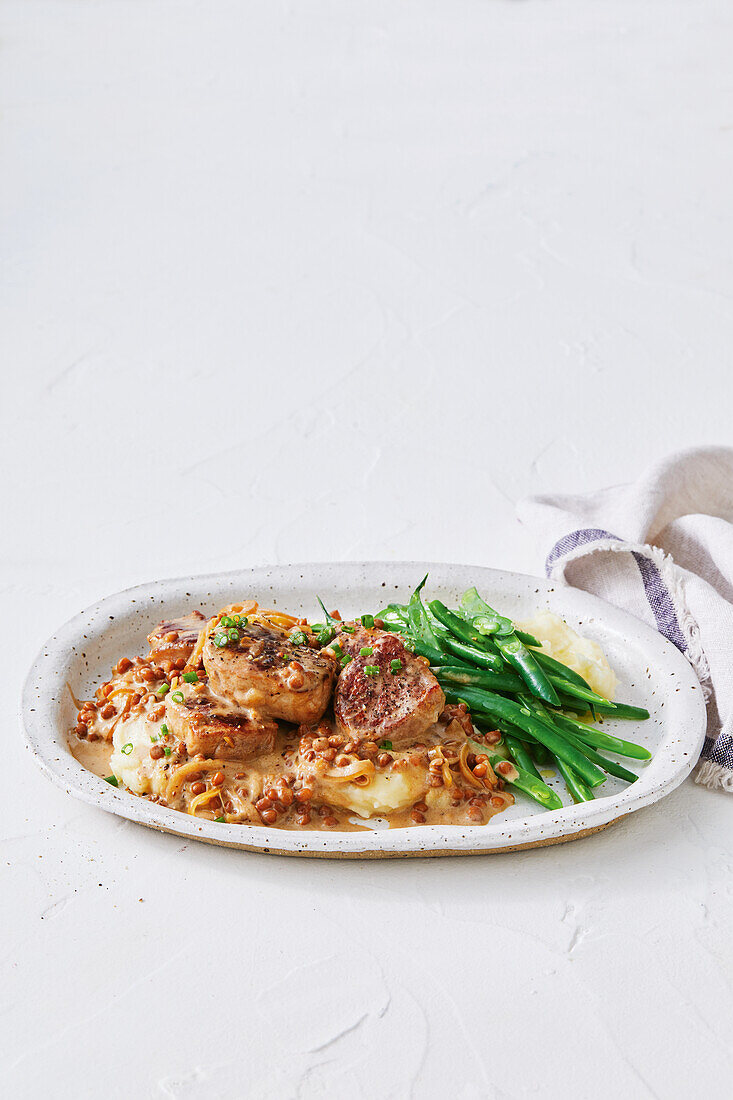 French roast pork with green beans and lentil vegetables