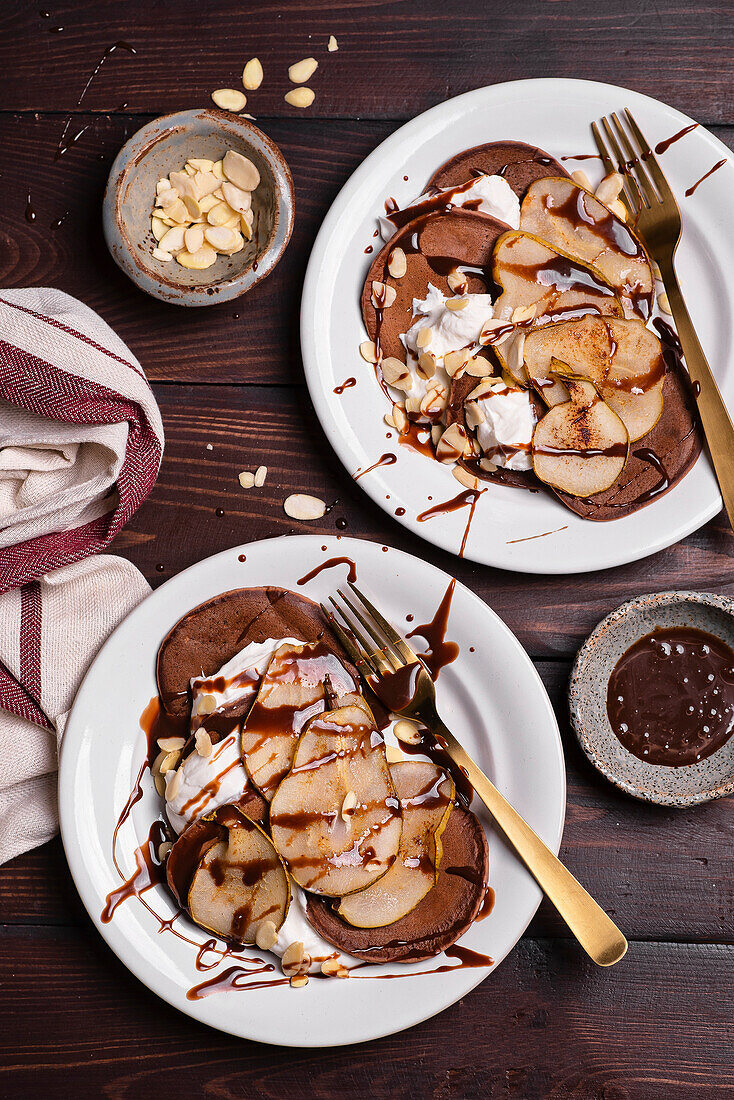 Chocolate pancakes with pear, yoghurt and almonds