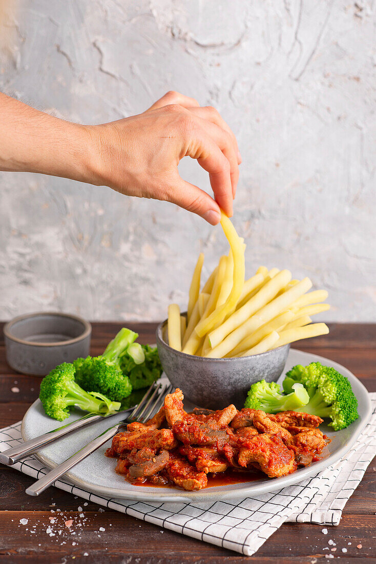 Pork in tomato sauce with beans and broccoli