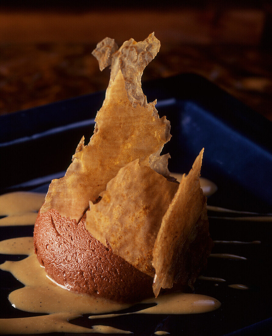 Chocolate mousse with coffee flavour and sponge leaves