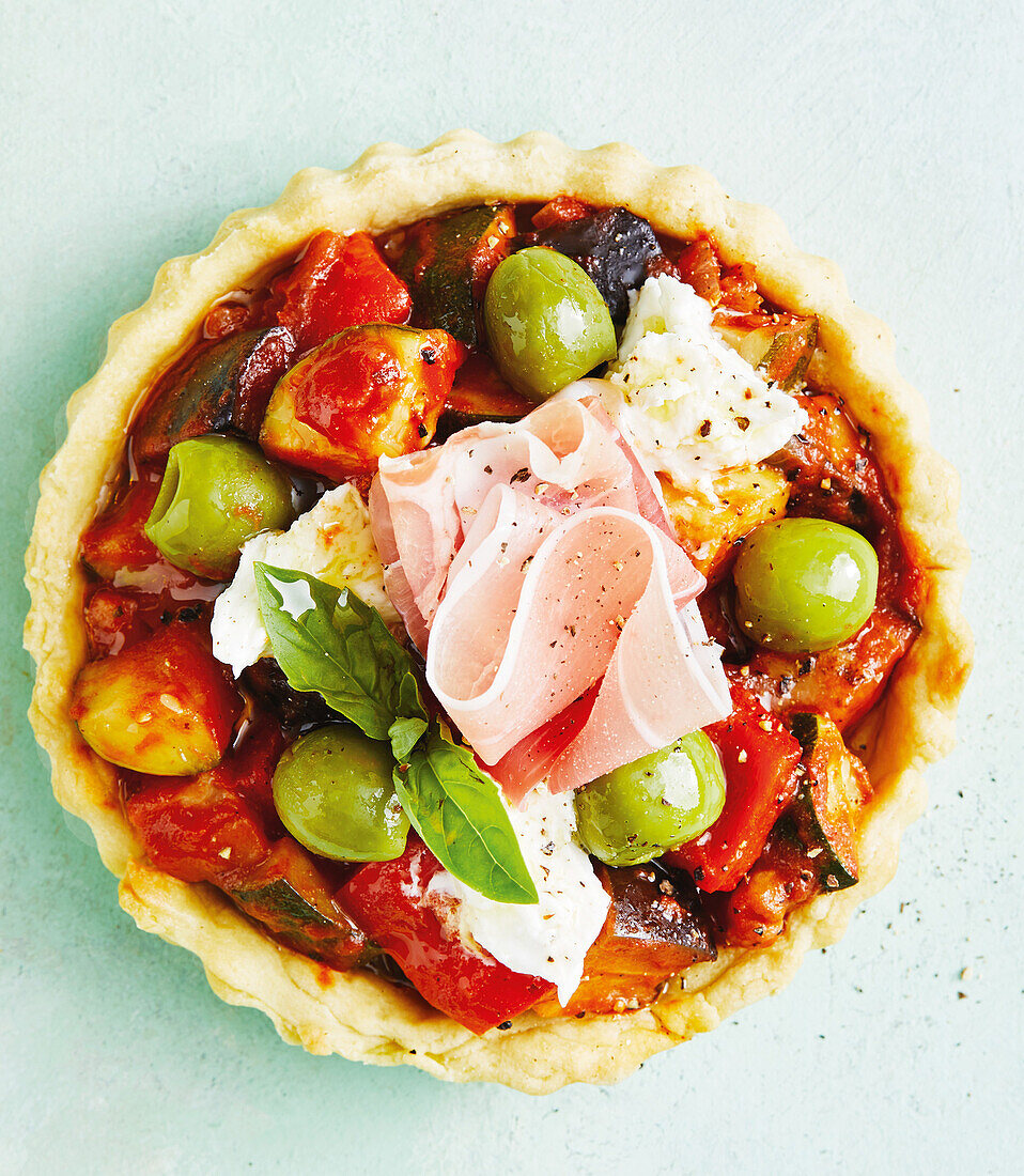 Vegetable tart with olives and vegan ham