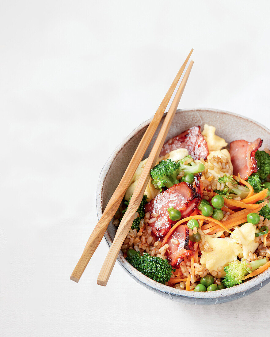 Sticky fried vegetable rice with maple syrup and bacon