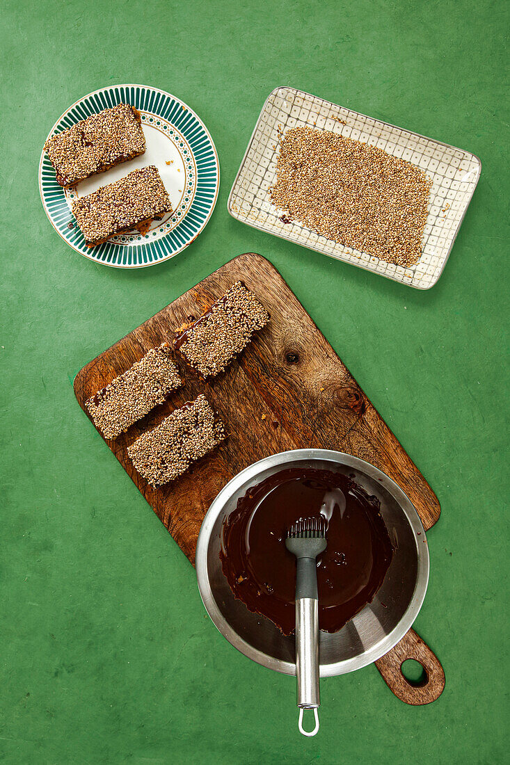 Prepare homemade muesli bars with chocolate coating