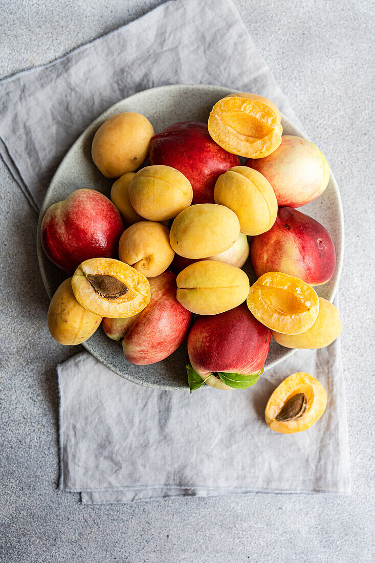 Whole and halved apricots and nectarines