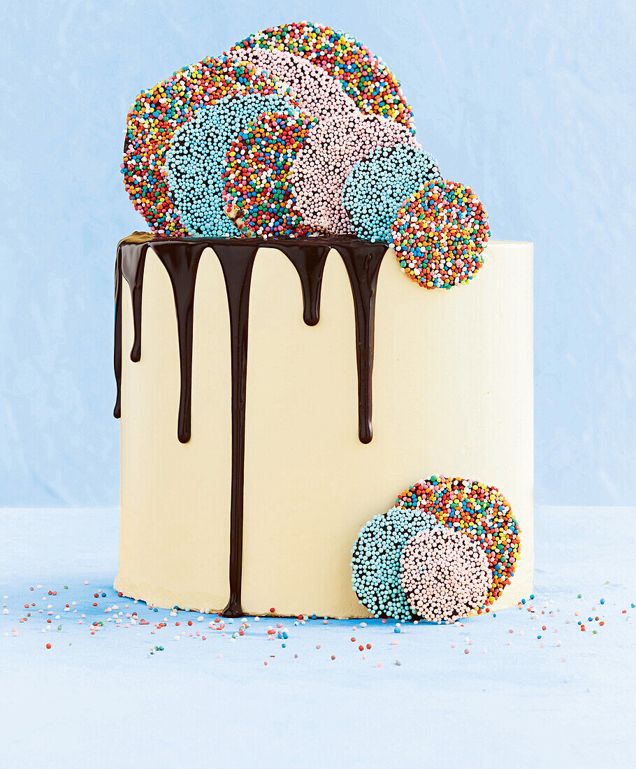 Cake with chocolate icing and colourful sprinkles