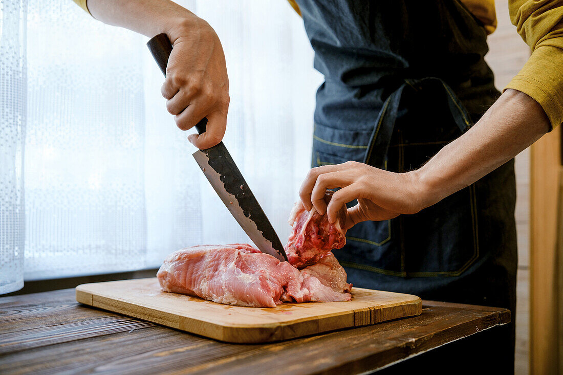 Carve the pork shoulder