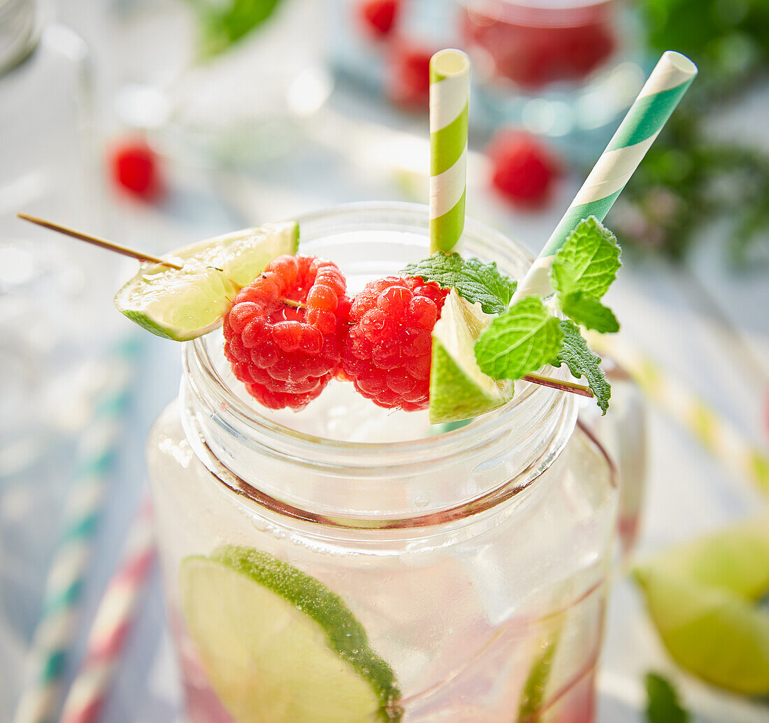 Summery raspberry and lime lemonade in a glass