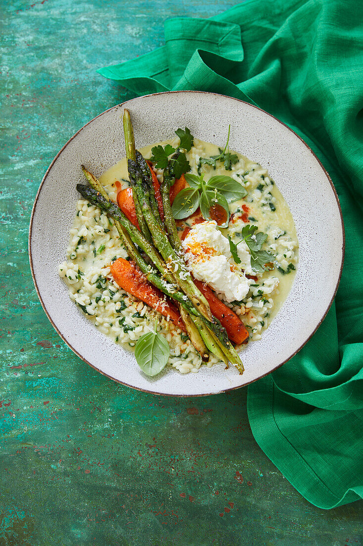 Spinach risotto with peppered asparagus and harissa carrots