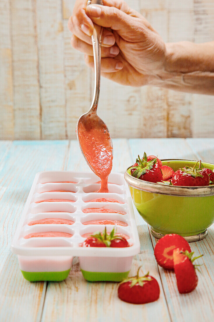 Making strawberry ice cubes