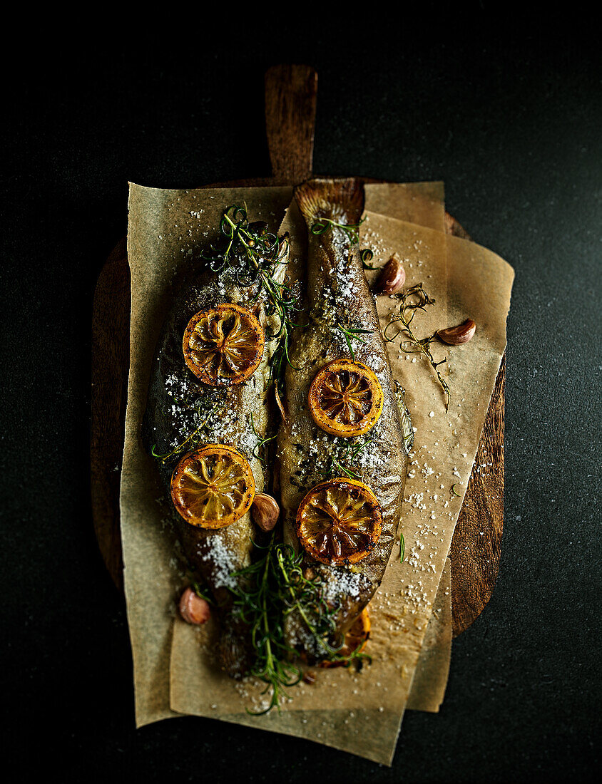 Oven-baked trout with lemon, garlic and rosemary