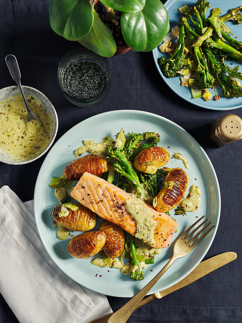 Salmon with creamy pesto sauce and Hasselback potatoes