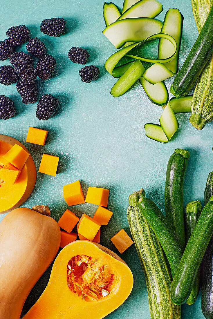 Various raw vegetables and blackberries