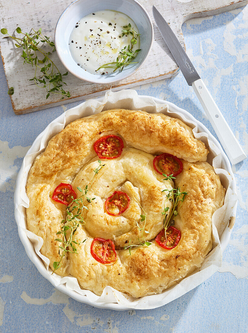 Banitsa (Bulgarian cheese pâté) with tomatoes and garlic