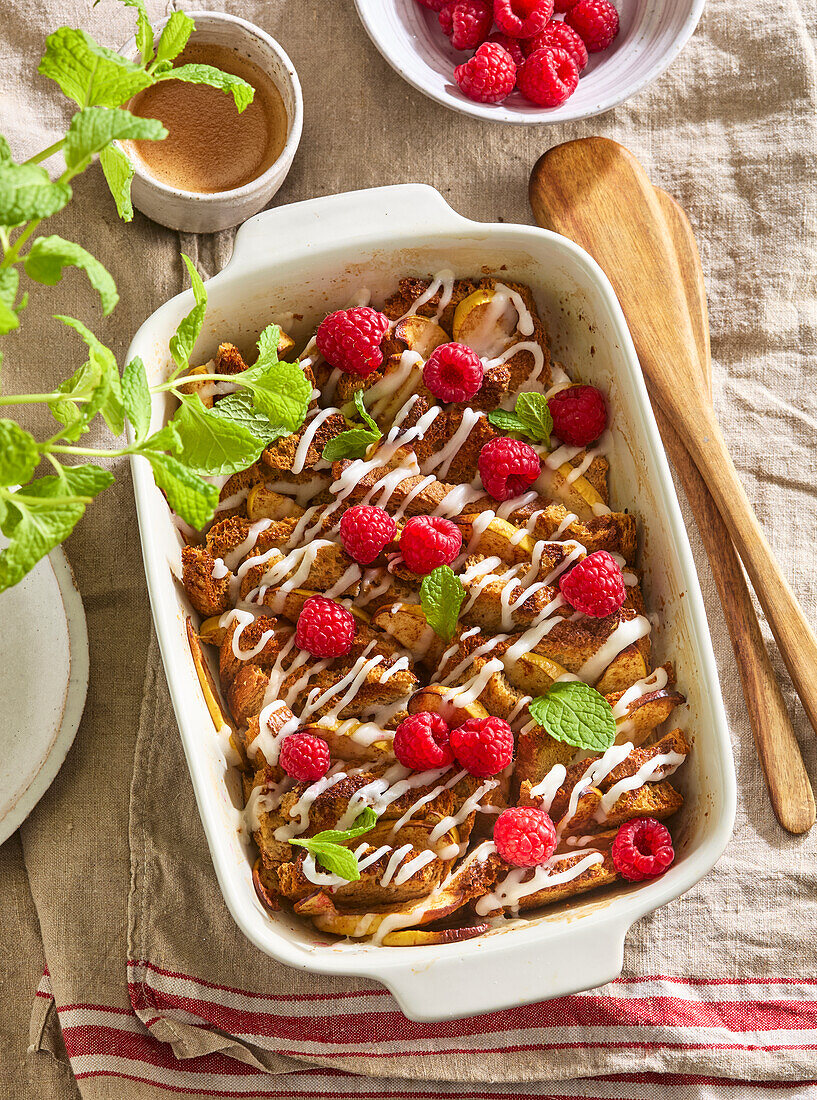 Baked French toast with apple, raspberries and cinnamon from the oven