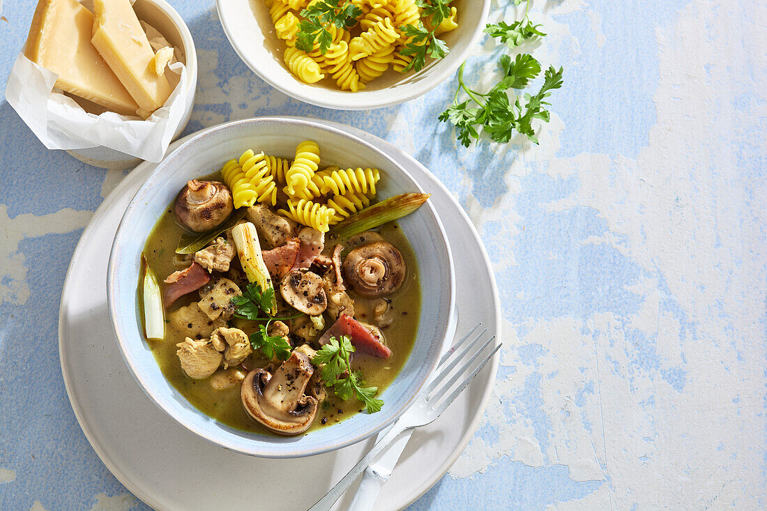 Chicken and mushroom stew with fusilli and parmesan