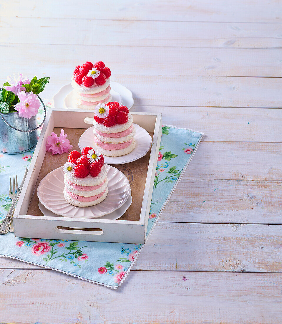 Mini meringue tarts with raspberry cream