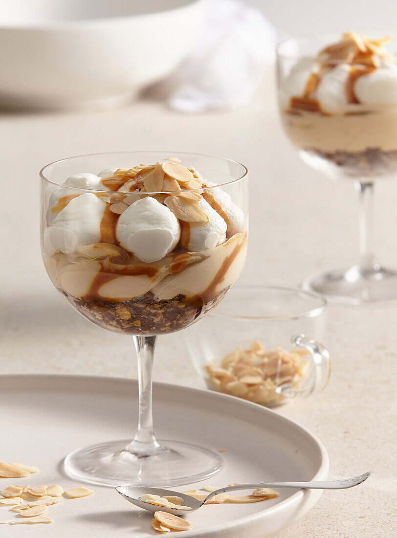 No-bake caramel cheesecake in a jar with almonds