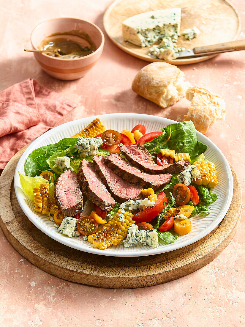 Salad with grilled beef steak, blue cheese and sweetcorn